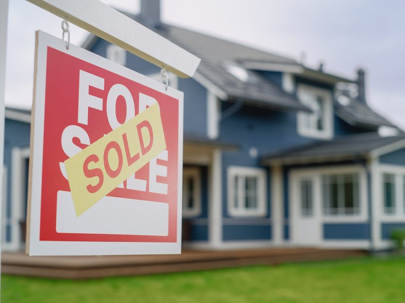 Close up of a house sold sign