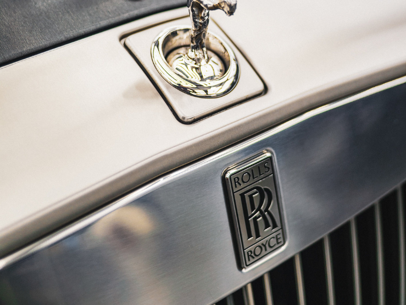 Close up of rolls royce car emblem