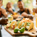 Friends eating tacos at a restaurant
