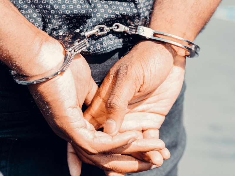 Close up photo of person in handcuffs