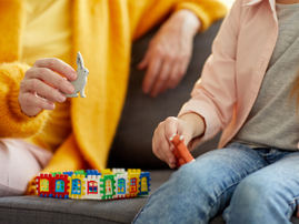 Closeup of a woman playing with a child