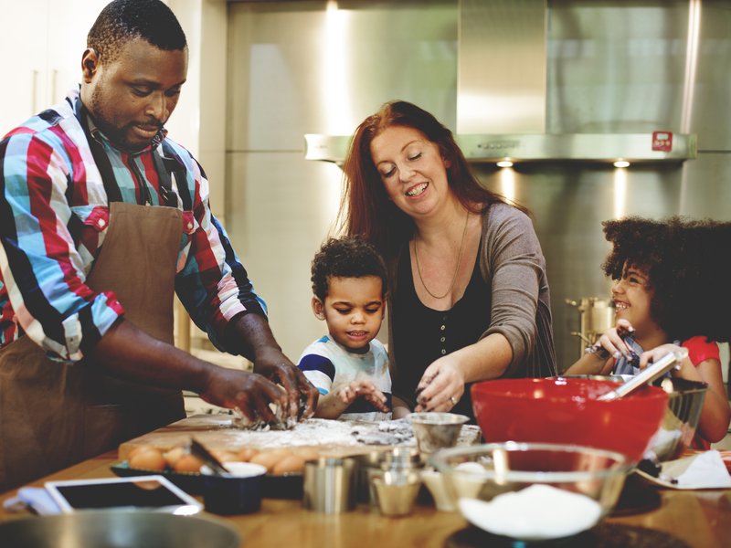 Family making food together