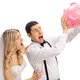 Newlywed couple shaking an empty piggybank