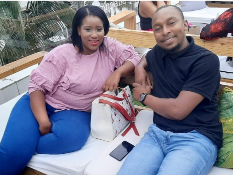 Couple seated next to each other smiling