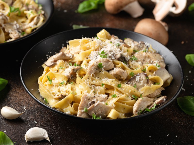 Creamy Alfredo pasta with chicken, mushrooms and parmesan cheese