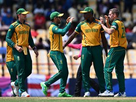 South Africa celebrates after winning the ICC men's Twenty20 World Cup 2024 Super Eight cricket match between England
