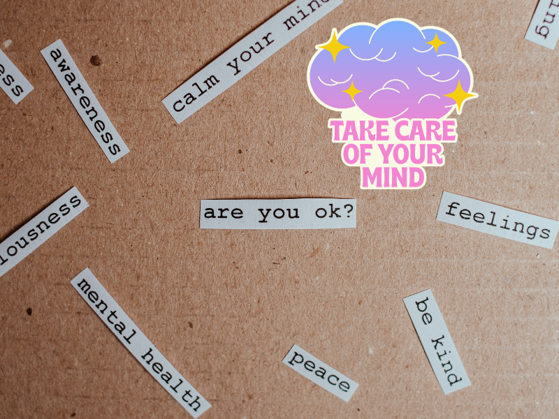 Cut out papers on cardboard referring to mental health