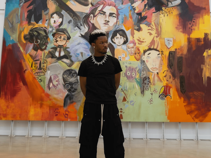 D4vd posing in front of an Arcane mural