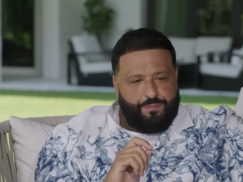 DJ Khaled sitting on a chair during an interview