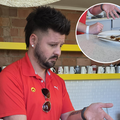Danny Guselli pointing at a dirty plate in the ECR kitchen