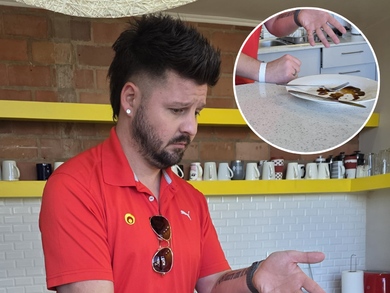 Danny Guselli pointing at a dirty plate in the ECR kitchen