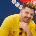 Danny Guselli poses at the Season of Sharing event