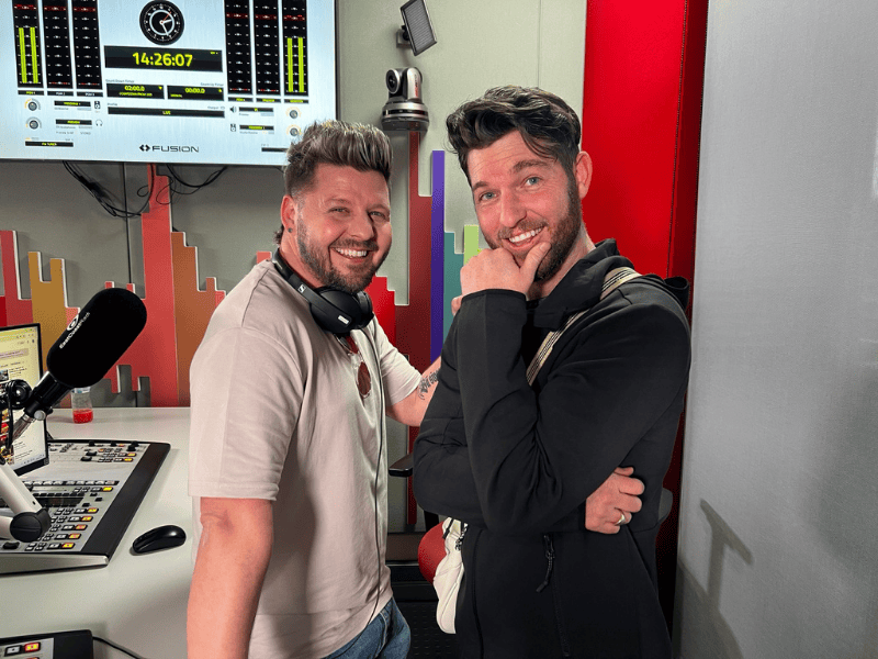 Danny Guselli posing with Kyle Deutsch at East Coast Radio studio
