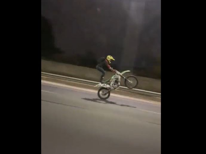 Stunt man showing off his daredevil skills.