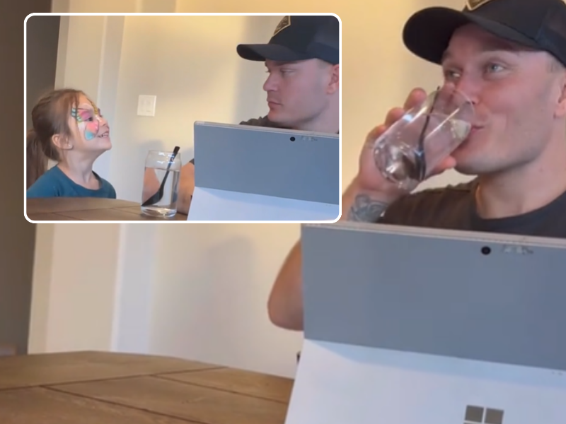 Daughter giving dad a glass of water