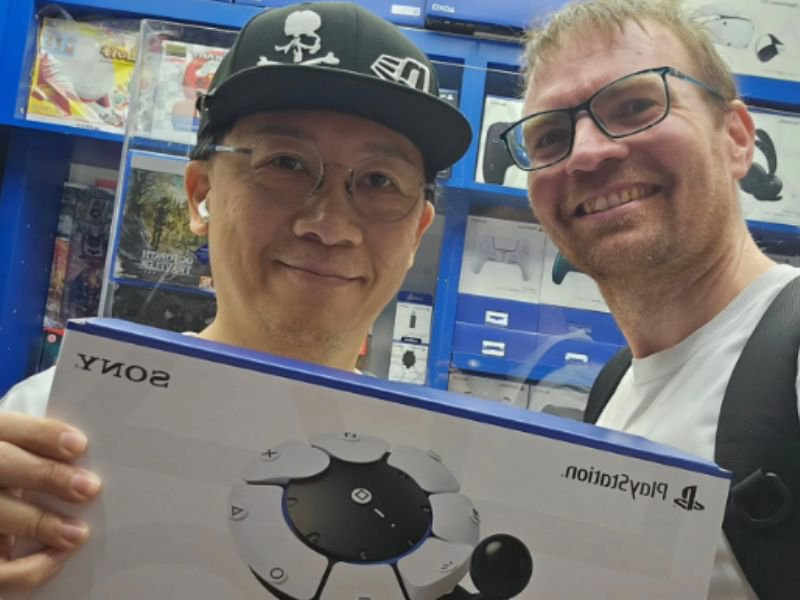 David Williams (right) with a game shop owner in Hong Kong