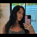 Demi Lovato takes a mirror selfie with an iPhone