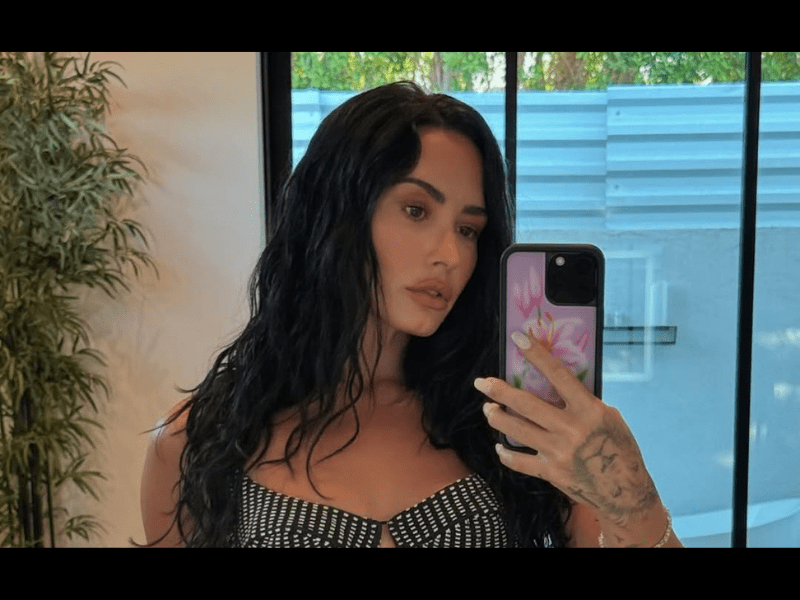 Demi Lovato takes a mirror selfie with an iPhone