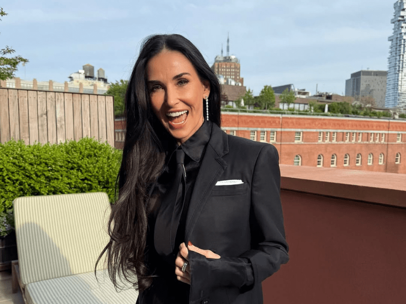 Demi Moore wearing a black blazer and shirt