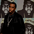 Sean Diddy Combs wearing a diamond cross chain