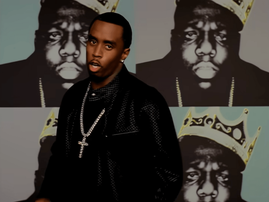 Sean Diddy Combs wearing a diamond cross chain