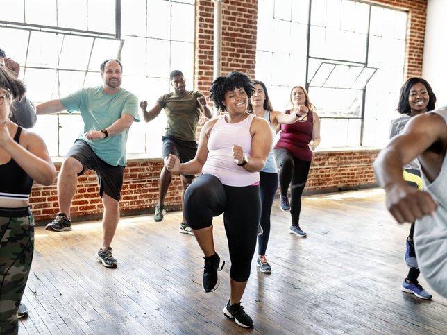 Diverse people in an active dance class