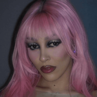 Doja Cat wearing a pink wig