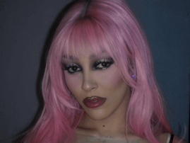 Doja Cat wearing a pink wig