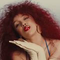 Doja Cat with big curly red hair