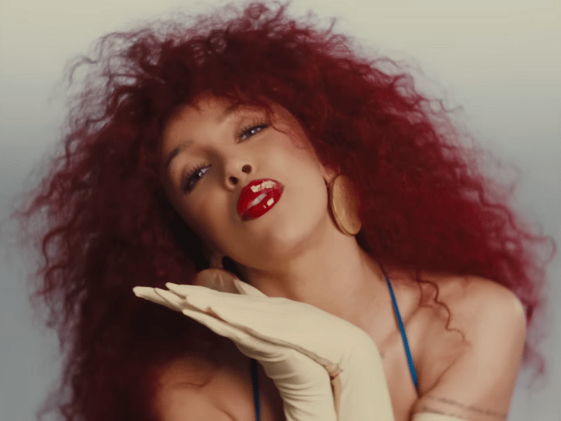 Doja Cat with big curly red hair