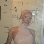 Doja Cat with short blonde hair.png