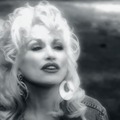 Black and white close up picture of Dolly Parton