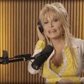 Dolly Parton singing in a recording studio