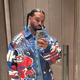 Drake sporting pigtails with blue hair bobbles
