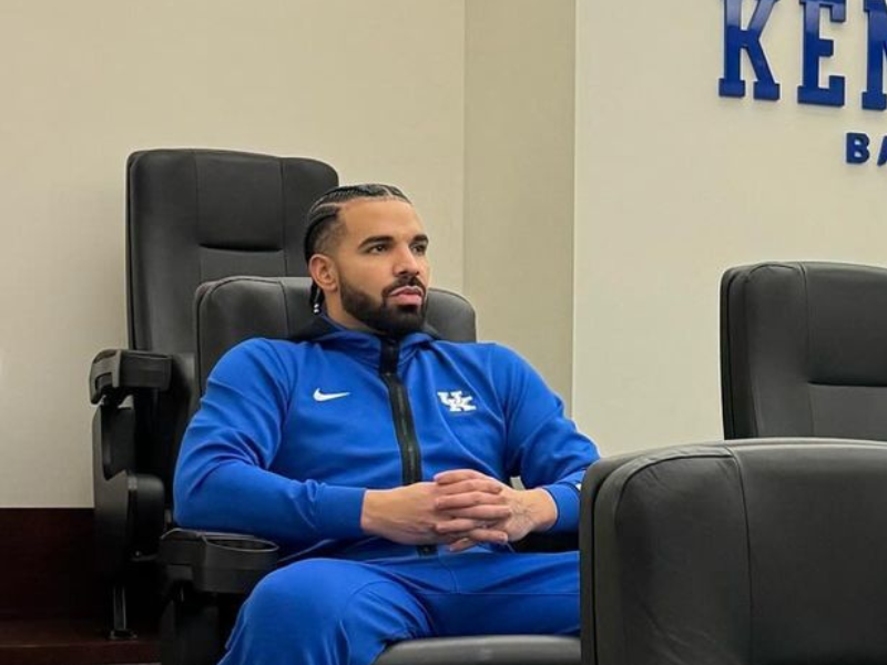 Drake wearing a blue tracksuit