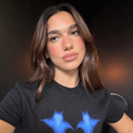 Dua Lipa wearing a black t shirt