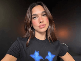 Dua Lipa wearing a black t shirt