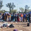 Women line up for food at the Durban Drive in site