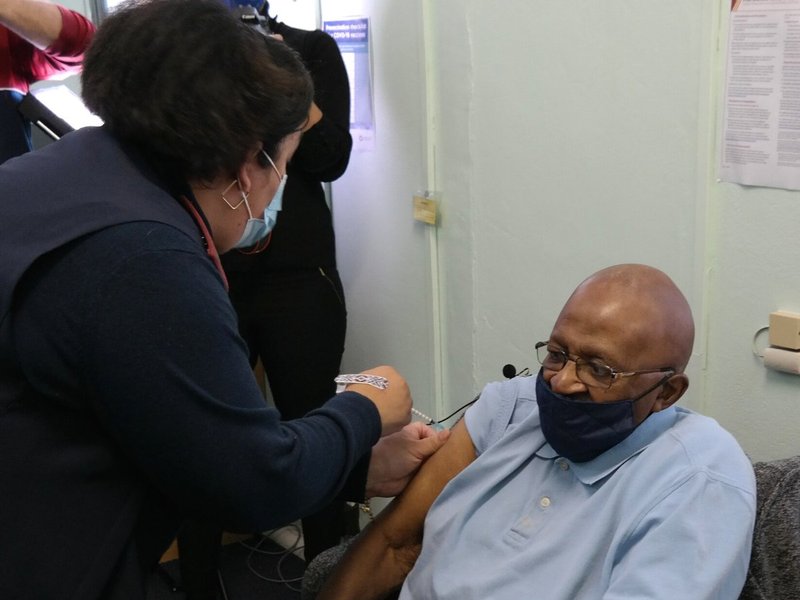 Tutu being vaccinated