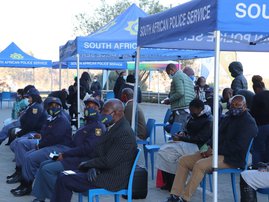 police officers queue for vaccine