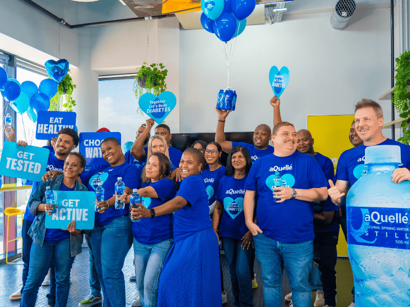 East Coast Radio team members posing with their blue shirts on World Diabetes Day
