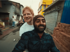 Ed Sheeran and Arijit Singh riding a scooter