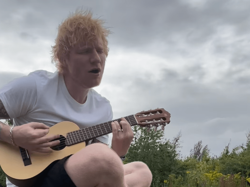 Ed Sheeran playing a guitar