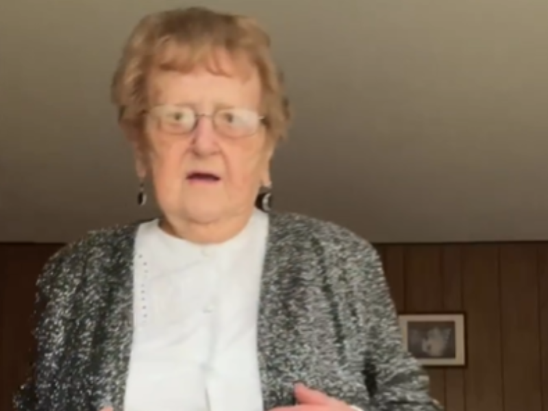 Elderly woman wearing a smart outfit