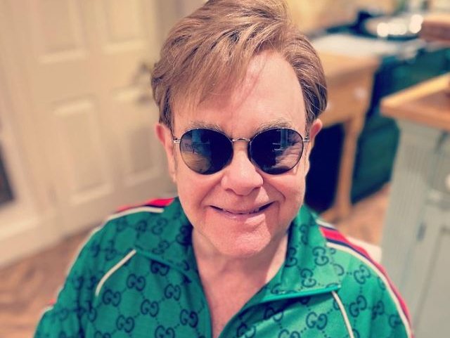 Elton John wearing dark shades
