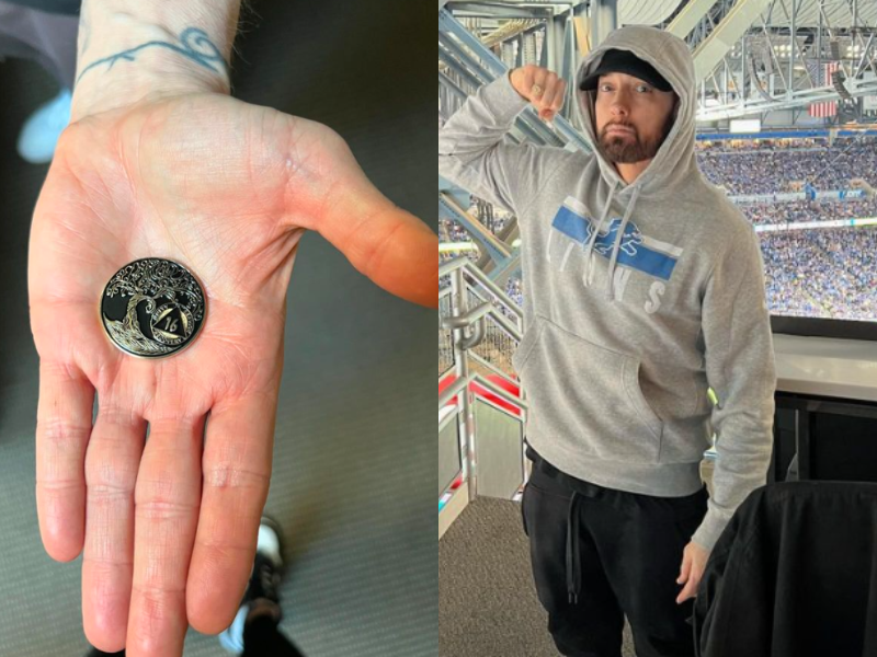 Eminem wears a hoodie, shows off recovery coin