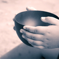 Child with empty bowl