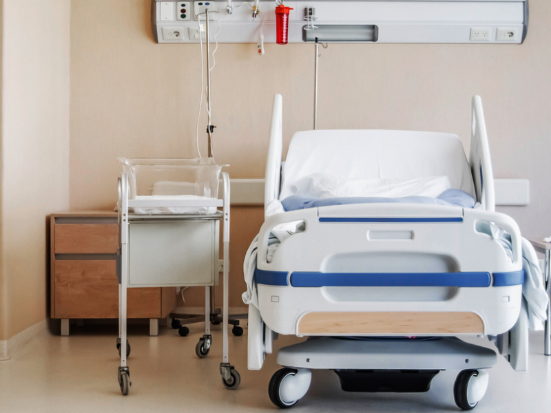 Empty hospital bed and crib