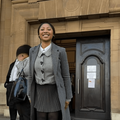 Enhle Mbali Mlotshwa poses outside a courtroom