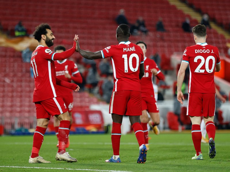 Liverpool spark Anfield party to join Spurs at top of Premier League